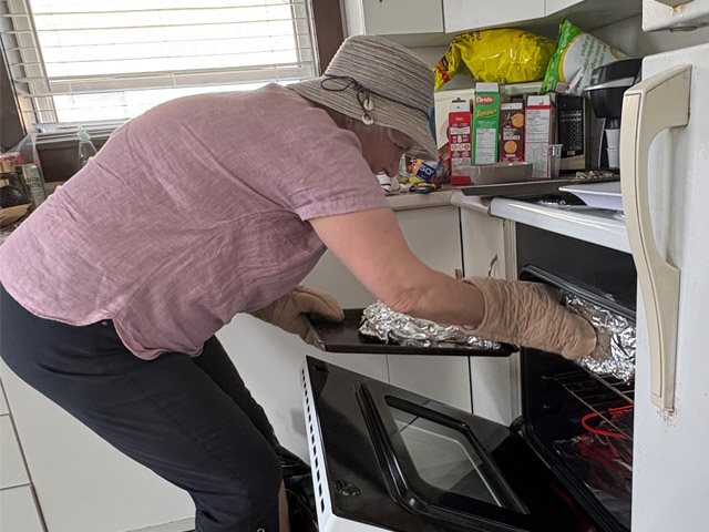 Taking food from oven