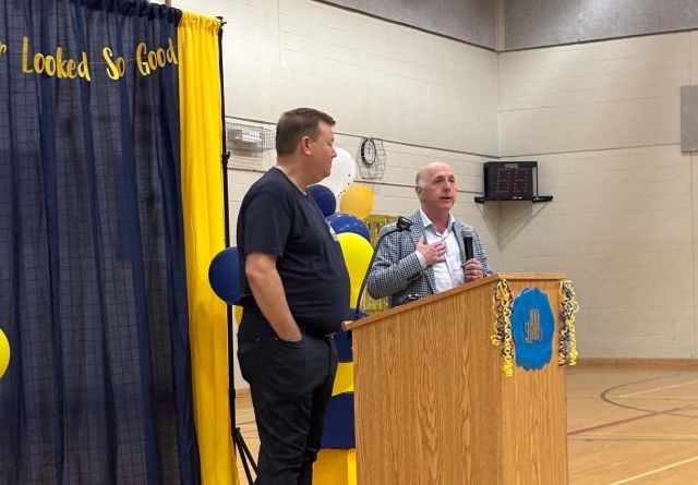 Two men at a podium