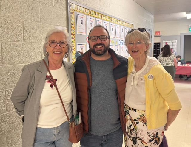Three people standing together