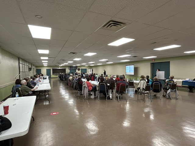 Speaker talking to a large room of people